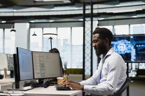 System administrator in office training machine learning models Stock Photos