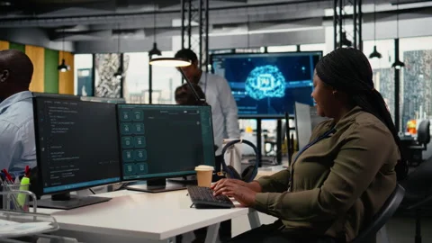 System administrator in office using AI LLM chatbot Stock Footage 322706699