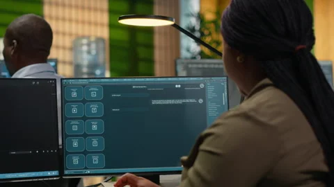 System administrator in office using AI LLM chatbot Stock Footage 323030223