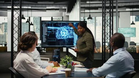System administrator presents AI chatbot reducing work volume to executives Foto stock