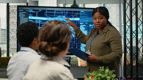 System administrator presents AI chatbot reducing work volume to executives Stock Photos