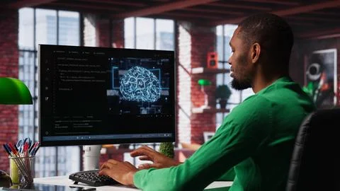 System administrator programming AI brain computerized model Stock Photos
