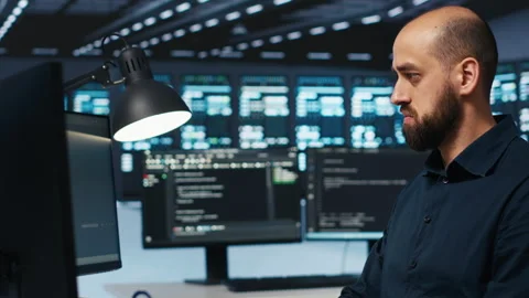 System administrator programming in server farm Stock Footage 274567487