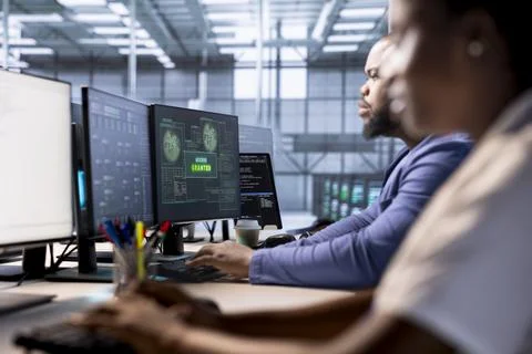 System administrator receiving access granted notification in server farm Stock Photos