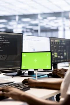 System administrator in server hub using green screen tablet Foto stock