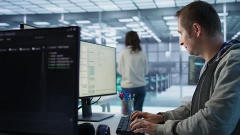 System administrator in server room doing system analysis, coding Stock Footage 319270733