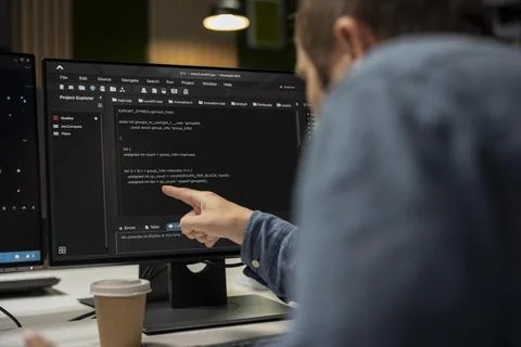 System administrator in startup office optimizing code 写真素材