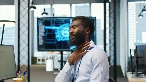 System administrator in tech startup office using PC, troubleshooting hardware Stock Photos