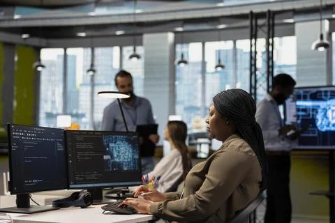 System administrator in tech startup uses AI on PC to optimize performance 写真素材