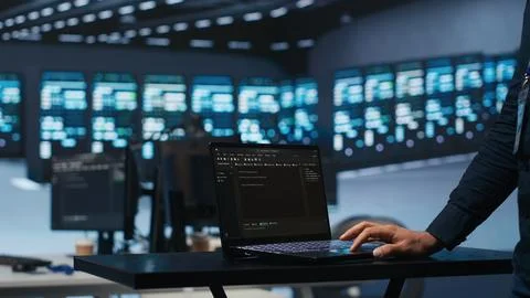 System administrator uses notebook to oversee supercomputers 스톡 사진