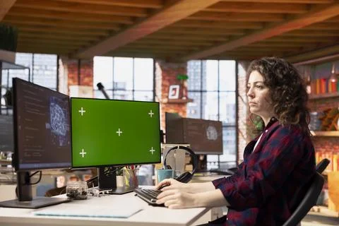 System administrator using isolated screen PC in AI tech startup 스톡 사진