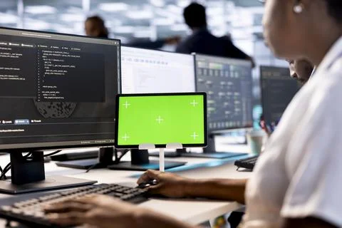 System administrator using mockup device to look for errors 스톡 사진