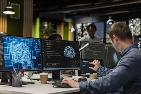 System administrator utilizing AI on PC to optimize performance Stockfoto's