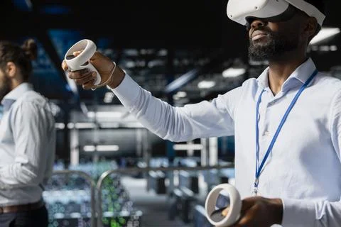 System administrator with VR headset using artificial intelligence technology Stock Photos