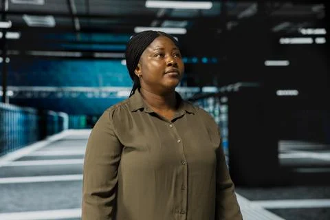 System administrator walking in data center Stock Photos