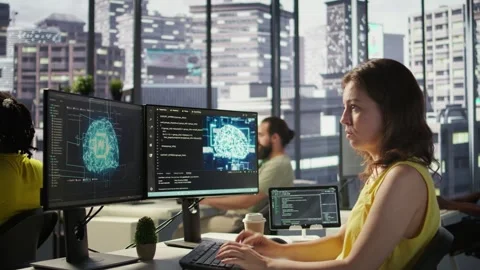 System administrator at work doing debugging of AI software using PC, Stock Footage 318161642