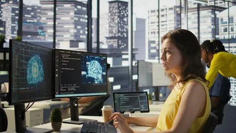 System administrator at work doing debugging of AI software using PC, 스톡 사진