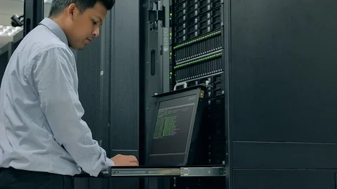 System administrator working in data center Stock Footage