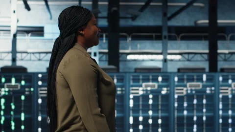 System administrator working in data center to optimize network Stock Footage 317126639