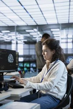 System administrator working in high tech AI facility 스톡 사진