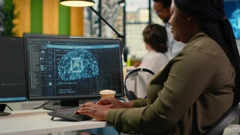 System administrators brainstorming in office, using AI specialized hardware Stock Footage 323404988