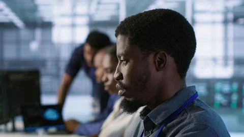 System administrators in data center implementing AI systems Stock Photos