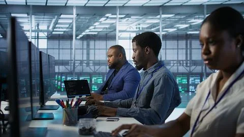 System administrators in data center implementing AI predictive systems Stock Photos