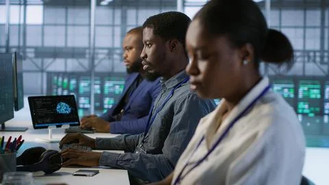 System administrators in data center implementing AI predictive systems Stock Photos