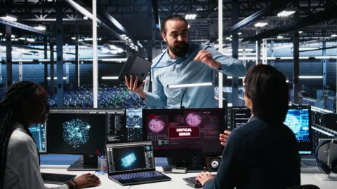 System administrators in data center struggle with computer bugs while using AI Stock Footage 313569893