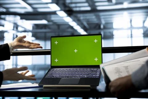 System administrators in data center using chroma key green screen laptop Stock Photos