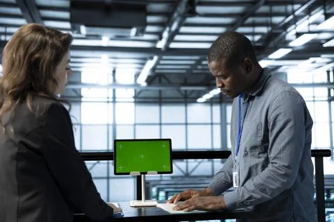 System administrators in data center using isolated screen mockup laptop 스톡 사진
