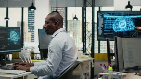 System administrators in office automate workflows using artificial intelligence Stock Footage 323031522
