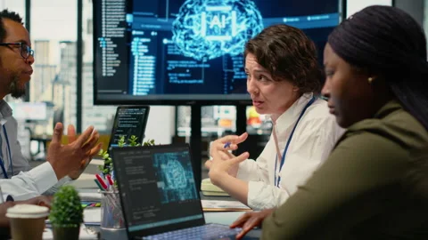System administrators in startup office brainstorming leverage AI tech Stock Footage 322706529