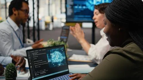 System administrators in startup office brainstorming leverage AI tech 스톡 사진