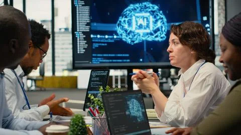 System administrators in startup office brainstorming leverage AI tech 스톡 사진