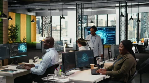 System administrators in startup office work with artificial intelligence Stock Footage 322709143