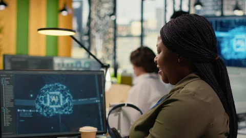 System administrators in startup office work with artificial intelligence Stock Footage 323143654