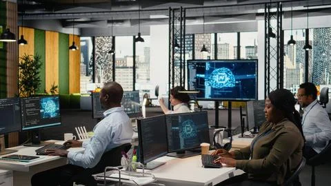 System administrators in startup office work with artificial intelligence 写真素材