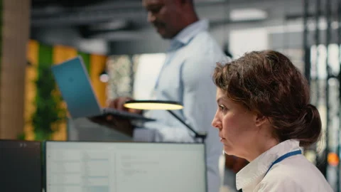 System administrators working in AI startup training predictive models Stock Footage 323031058