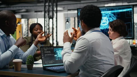 System administrators working in AI startup training predictive models Stock Footage 323033269