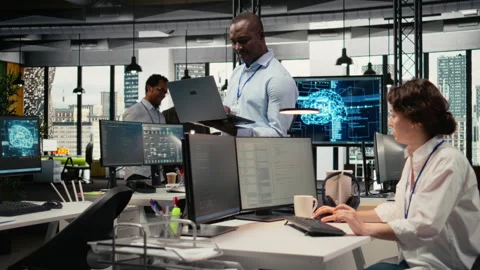 System administrators working in AI startup training predictive models Stock Footage 323239569