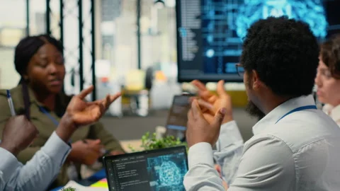 System administrators working in AI startup training predictive models Stock Footage 323407858