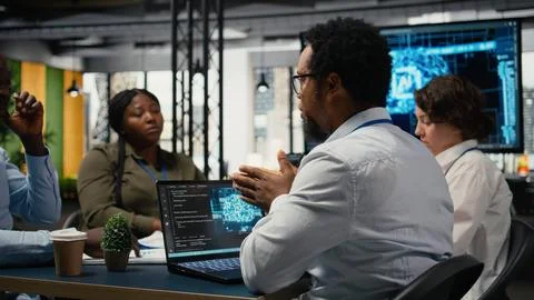 System administrators working in AI startup training predictive models Stock Photos