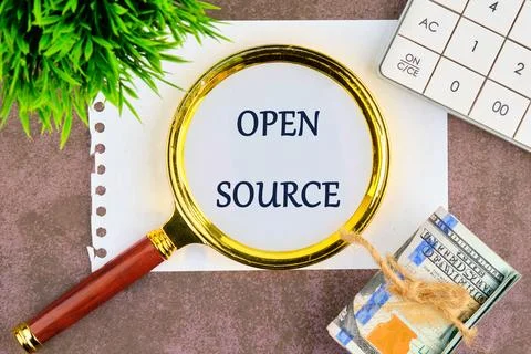 System and website builder concept. OPEN SOURCE through a magnifying glass on 写真素材