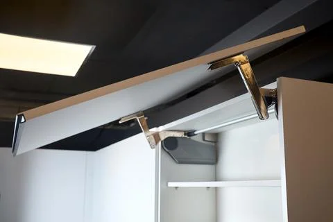 System for bi-fold fronts and facades for kitchen cabinets direct access. Ele Foto stock