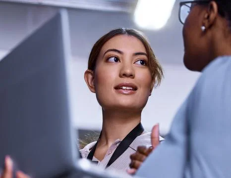 System check Complete. two attractive young female computer programmers working Stock Photos