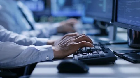 In the System Control Center Team of Technicians Monitor System Stability.  Stock Footage 74928025