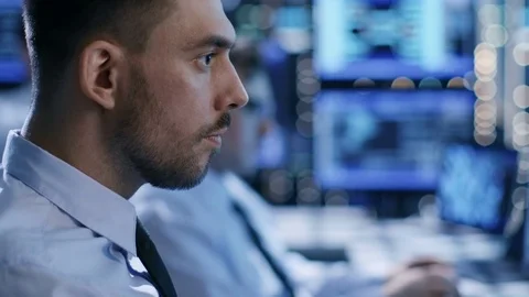 In the System Control Center Team of Technicians Monitor System Stability.  Stock Footage 74994900