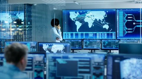 In the System Control Room Chief Engineer Thinks While Standing Before Big Sc 스톡 사진