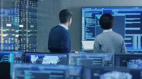 In the System Control Room IT Specialist and Project Engineer Have Discussion. 스톡 동영상 80982272